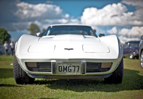 older corvette at a car meet spray waxed