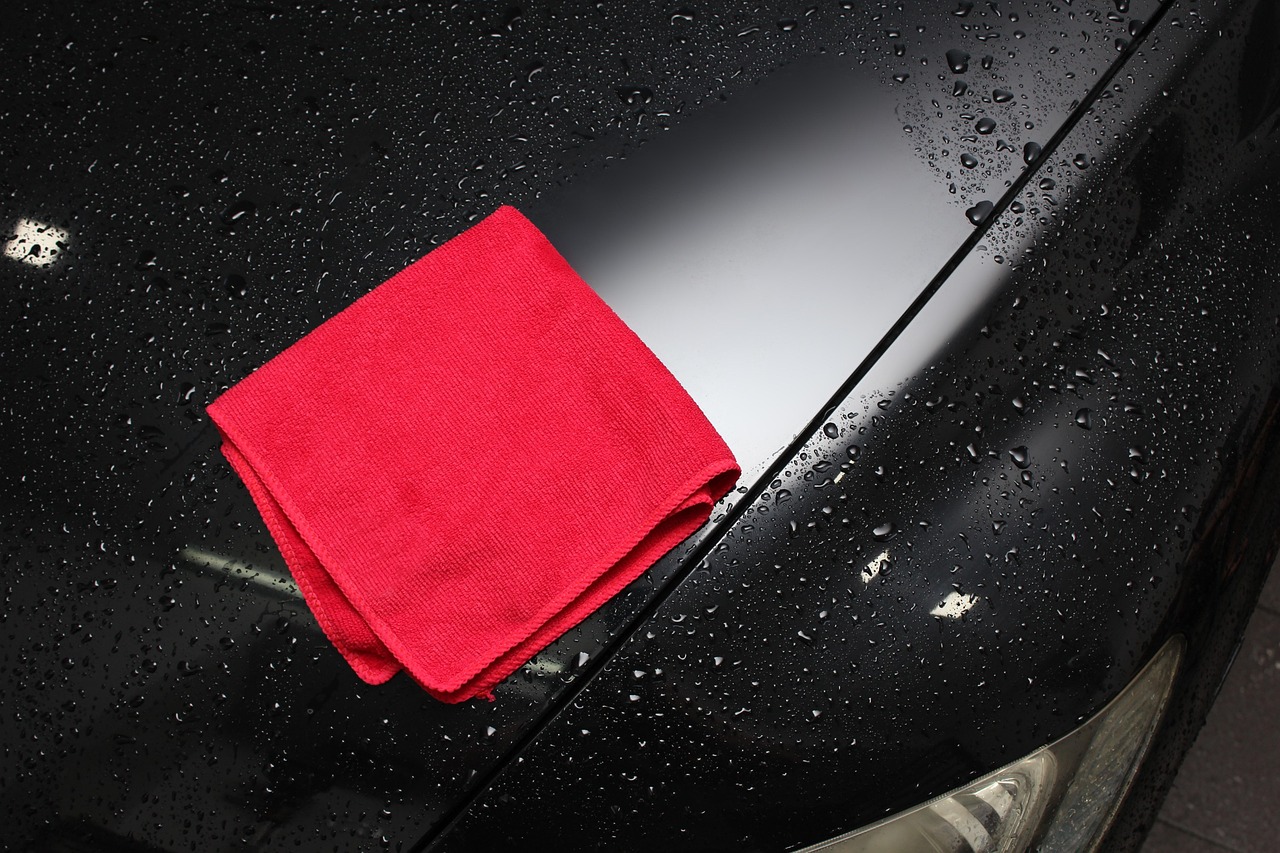 microfiber towel cleaning a car